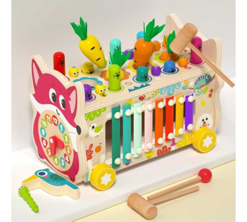 Каталка C 75299 (24) дерев'яна, ксилофон, грядка з морквинами, рухомі шестерінки, гра з “вибиванням” фігурок, годинник з рухомими стрілками, магнітні черв’ячки і пташка, дзеркало, в коробці