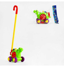 Каталка 0513 (72/2) "Динозаврик", на паличці, з дзвінкими елементами, у пакеті