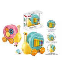Каталка 58079 (16) 2 кольори, “Равлик”, ксилофон, запускач, пальчикова гра, брязкальце, в коробці