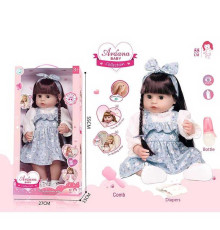 Лялька A 911 E (12/2) гумова, висота - 52 см, заплющує очі, функціональна, прошите волосся, рухомі кінцівки, пляшечка, підгузок, ходить на горщик, щітка для волосся, взуття, в коробці
