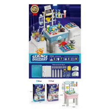 Набір хіміка 4097 A (8) 2 види, столик висотою 56 см, 5 баночок з фарбою, реактиви-порошки, 7 мірних склянок, лійка, м’ячик, 2 свічки, шприц без голки, піпетки, ложечка, повітряні кульки, окуляри, рукавички, трубочки, тарілка, в коробці