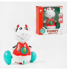 Корівка 818 (72/2) на батарейках, весела мелодія, підсвічування, рухається, реагує на плескання долонями, в коробці